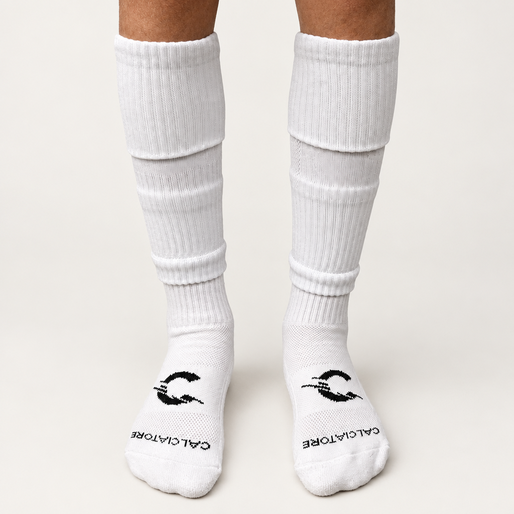 White football sock sleeves worn with white socks on a neutral background